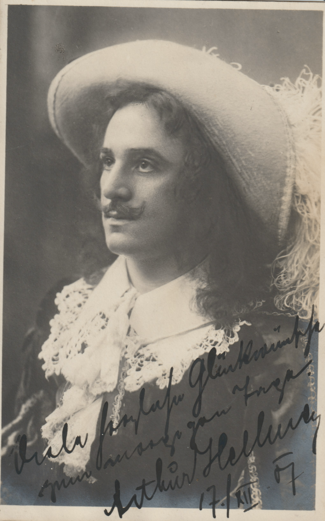 Arthur Hellmer — In costume — plumed cavalier (inscribed New Year's greeting)