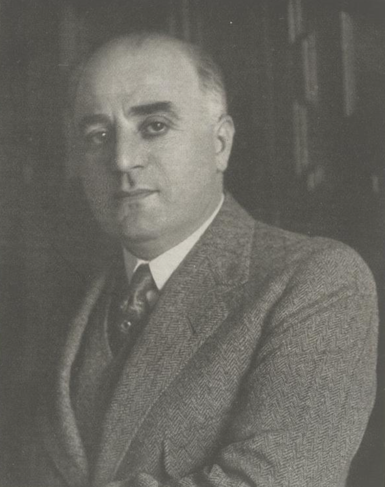 Arthur Hellmer — seated portrait in tweed jacket